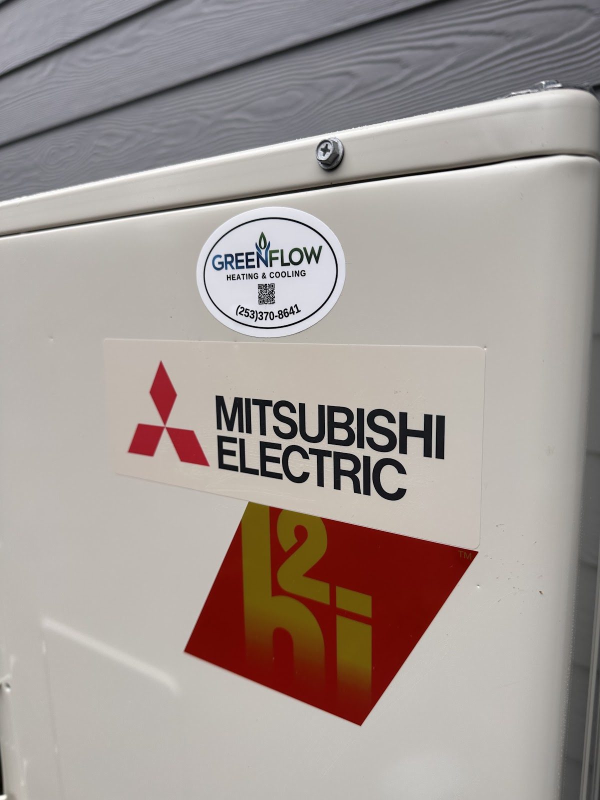 Mitsubishi Electric hyper-heat heat pump with GreenFlow service tag installed in Tacoma