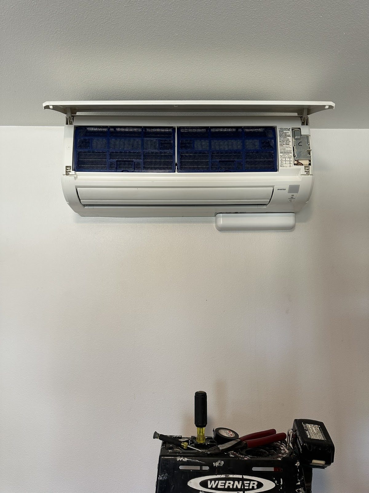 Wall-mounted ductless mini-split indoor head during install in a Pierce County home