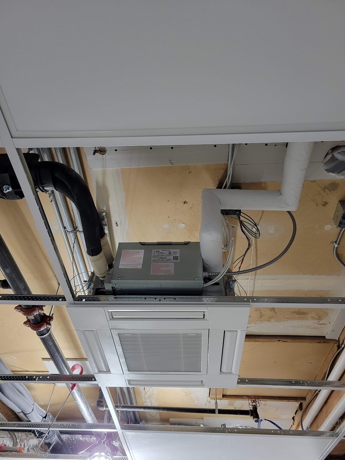Ceiling cassette ductless indoor unit installed in the ceiling of a South Sound home