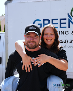 Christina Joslin owner of GreenFlow Heating and Cooling with lead foreman Nathan Joslin in front of a company truck