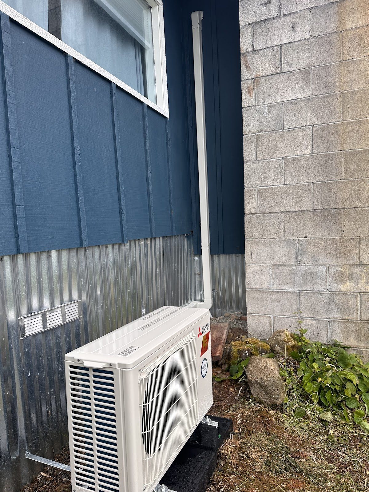 Outdoor heat pump condenser installed at a commercial building in Pierce County