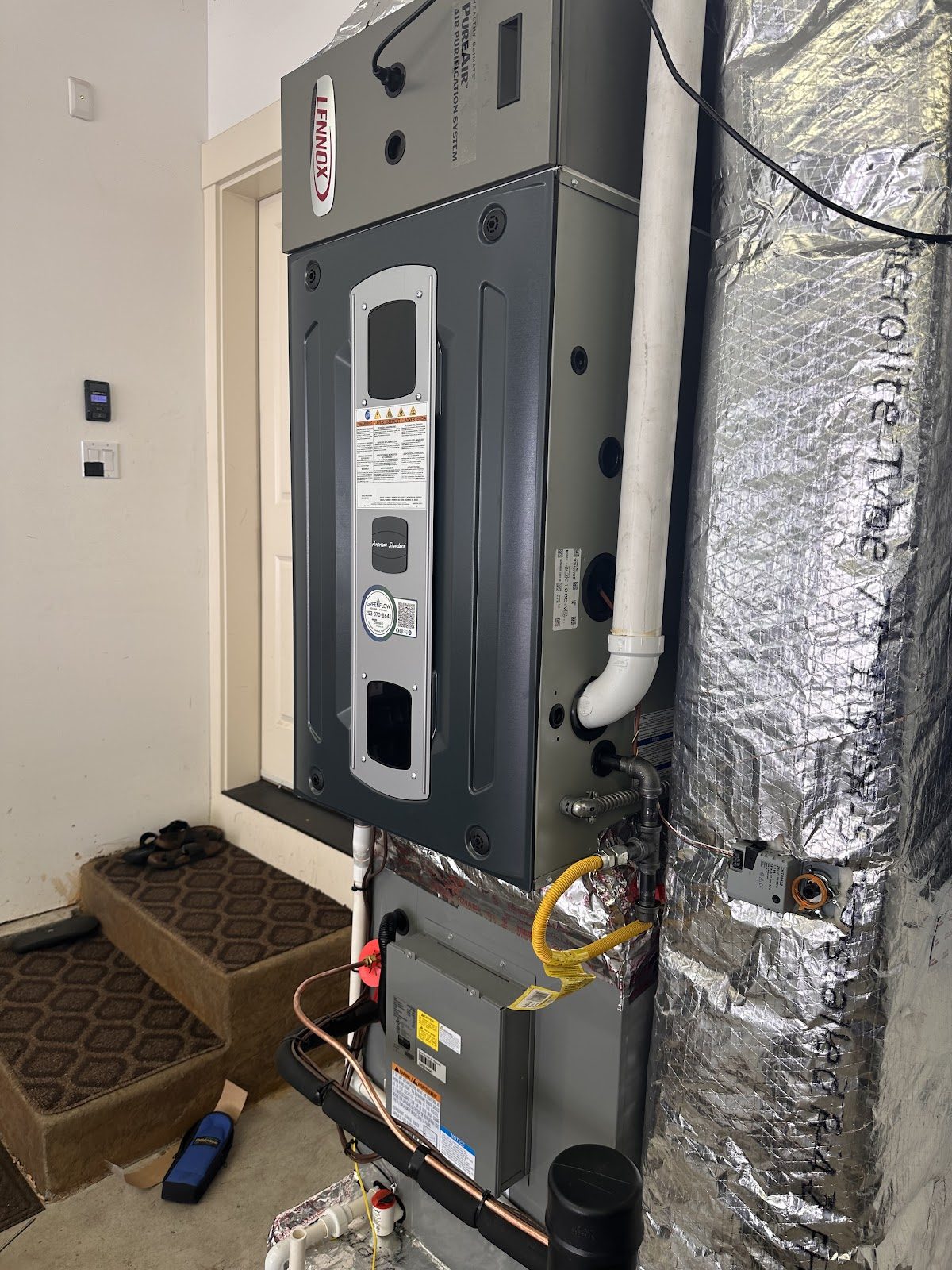 New high efficiency gas furnace installed in a mechanical closet